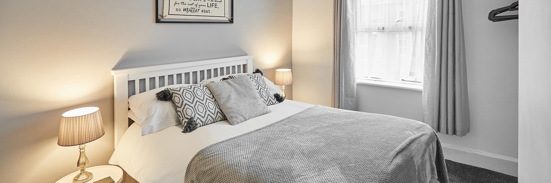 Bed with champagne, croissants and magazines