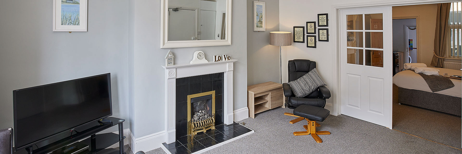 Champagne and croissants on a bed