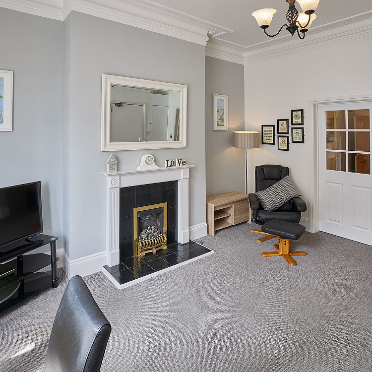 Champagne and croissants on a bed